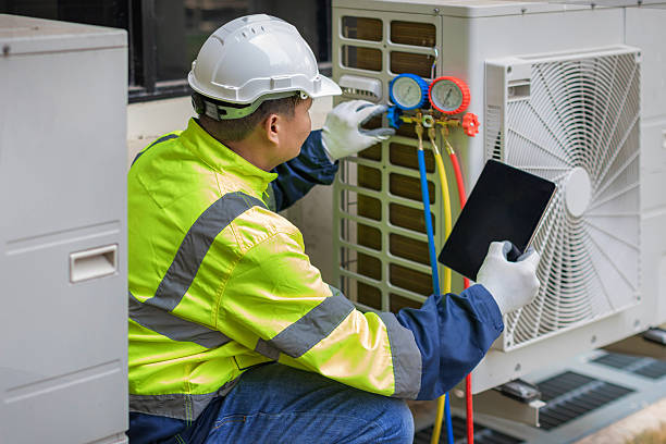 Professional Air Conditioning Repair technician working in Reasnor, IA